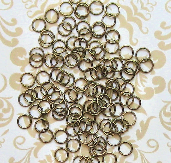 250 anéis de salto 6 mm alta qualidade tom bronze antigo J013 - Imagem 1 de 1