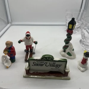 Department 56 The Original Snow Village Village Sign, Skier, Snowman Child/Ducks - Picture 1 of 7
