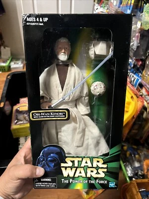 TOMY (FIGURA DE ACCIÓN) OBI-WAN KENOBI / CON SABLE DE LUZ RESPLANDOR EN LA OSCURIDAD 12 pulgadas Foto 1 de 4