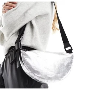 AllSaints Half Moon nylon crossbody bag in silver - Picture 1 of 13