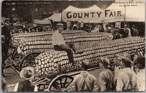 1910s W.H. MARTIN Photo Postcard "County Fair Contest on IOWA CORN" Exaggeration - Picture 1 of 2