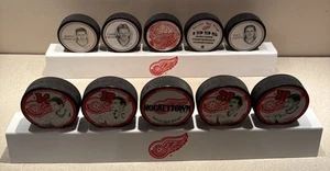 10 Vintage VEGUM Detroit Red Wings Hockey Pucks w/ 2 Stands Excellent Condition - Picture 1 of 13