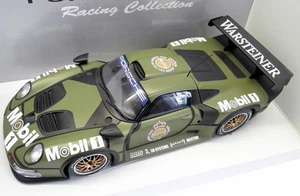 UT Models 1/18 Scale - 39627 Porsche 911 GT1 Test car - Camouflage - Picture 1 of 4