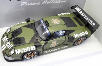 UT Models 1/18 Scale - 39627 Porsche 911 GT1 Test car - Camouflage - Image 1 of 4