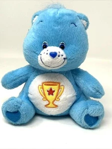 Juguete de peluche Care Bears Champ Bear azul con premio trofeo 2004 Nanco - Imagen 1 de 10