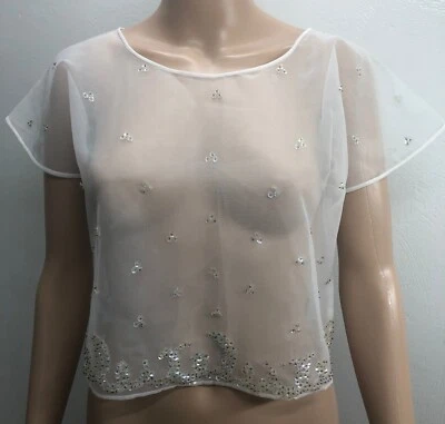 Top de mujer blanco de malla transparente con lentejuelas manga corta talla pequeña usado en excelente estado Foto 1 de 4