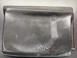 Nissan Owners Manual Case OEM Folding Black Vinyl - Picture 1 of 3