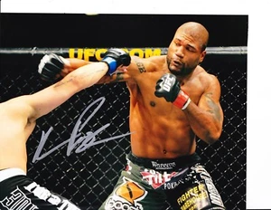 QUINTON RAMPAGE JACKSON SIGNED THROWING PUNCH 8X10 - Picture 1 of 1