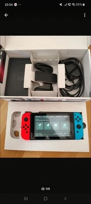 Nintendo Switch HAC-001 - 32GB - Spielkonsole - Neon-Rot/Neon-Blau 2017 V1 Unpat - Bild 1 von 3