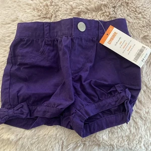 NUEVO CON ETIQUETAS Bebé Niñas Gymboree Púrpura Lateral Arco Burbuja Pantalones Cortos 12 - 18 Meses - Imagen 1 de 2