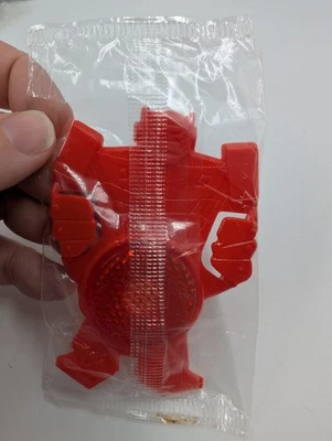 De colección 1985 Kellogg Cereal Premium Bicicleta Reflector Rojo Robot Transformador Foto 1 de 4