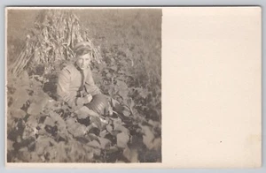RPPC Postcard WWI Era Uniformed Handsome Male Soldier Pumpkin Patch Halloween - Picture 1 of 2