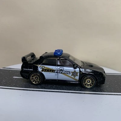 2012 Matchbox MBX Heroic Rescue #94/120 Subaru Impreza WRX Police Black 1:64 NM - Image 1 of 4