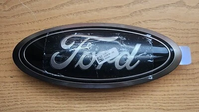 NEW 2023-2024 Ford F-150, F-250 Super Duty Black/Smoke Oval Tailgate Emblem, OEM - Image 1 of 3