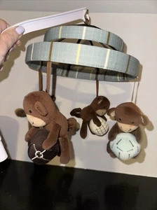 Mobile musicale Lambs & Ivy - Palline che tengono scimmie, blu, marrone e beige. - Foto 1 di 6