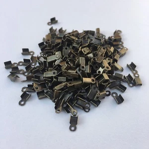 250X Conector de extremo de cable plegable plano hágalo usted mismo engarzamientos de joyería 6x2 mm hallazgos de bronce - Imagen 1 de 5