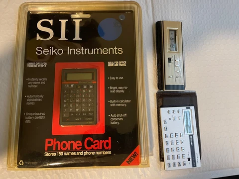 Vintage Electronics Seiko Phone Card, Bulova Clock, Unisonic Calculator, Rolodex Cover