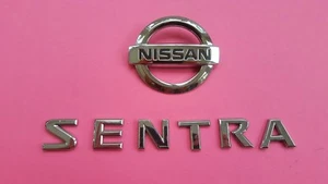 07 08 09 10 11 12 NISSAN SENTRA REAR LID EMBLEM LOGO BADGE SIGN SYMBOL LETTERS - Bild 1 von 4