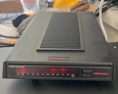 Módem comercial de mensajería U.S Robotics 3453C 56 kbps con adaptador de corriente Foto 1 de 4