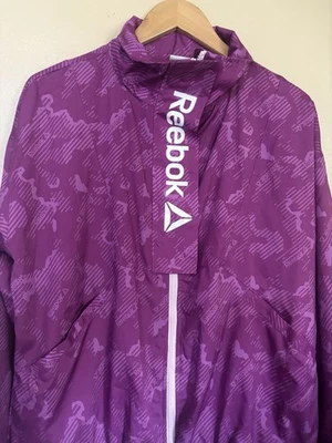 Chaqueta deportiva para mujer Rebook forrada de malla estampada Focus talla S rosa/púrpura (0162) Foto 1 de 4