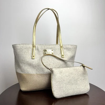 J680 - Bolso de Mano Kate Spade Harmony Lana Dorado Esmerilado y Muñequera sin asas Foto 1 de 4