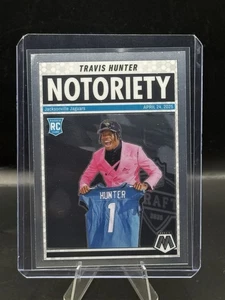 2025 Panini Mosaic - Notoriety #12 Travis Hunter (RC) Jaguars - Foto 1 di 2