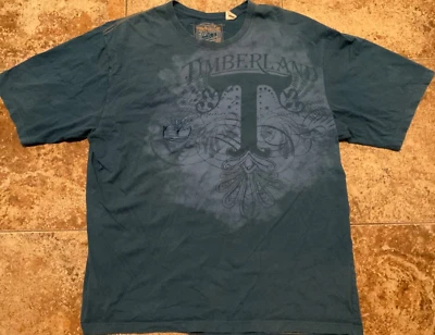 CAMISETA GRÁFICA VINTAGE Y2K TIMBERLAND BOOTS TODA ESTAMPADA (MASCULINA 2XL) - Imagem 1 de 4