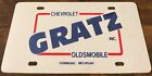 Gratz Chevrolet Oldsmobile Dealership Booster License Plate Dowagiac MI PLASTIC