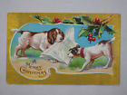 1908 Embossed Christmas Postcard Dogs Newspaper Holly Margaret Burun Solon IA US