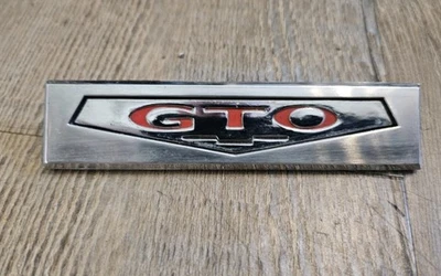 Pontiac GTO 1969 1970 emblema interior del panel de la puerta OEM GM 7790996 Foto 1 de 4