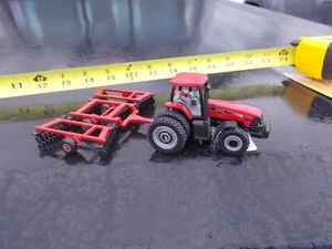 Case IH Traktor STX 240 Traktor & Klappflügelscheibengerät Maßstab 1:64 - Bild 1 von 7