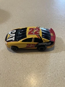 Coche Ranura NASCAR Caterpillar #22 - Imagen 1 de 5