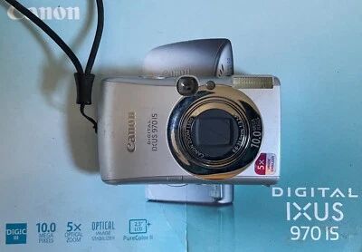 Canon IXUS 970 IS 10,0MP Digitalkamera + 2GB - Silber - OHNE LADEGERÄT - Bild 1 von 2