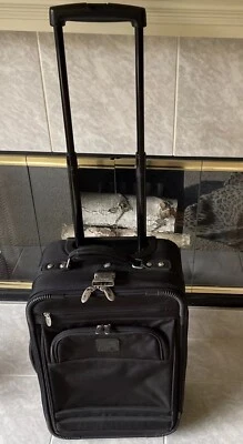 Dakota Tumi Ballistic Nylon 20" 2 Wheel Carry-On  Roller Bag Black Above Rest - Image 1 of 4