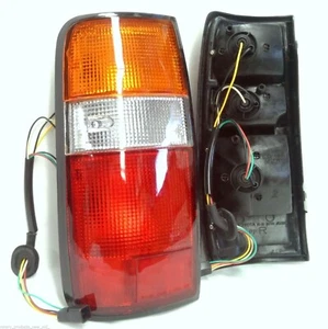 COMPLETE REAR TAIL LIGHT LAMP PAIR SUIT TOYOTA LANDCRUISER FJ82 LH RH - Picture 1 of 1