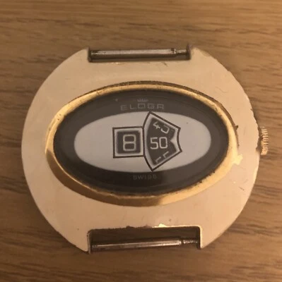 Reloj mecánico Eloga Jump Hour años 70 esmalte crema sin correa no funciona. Foto 1 de 4