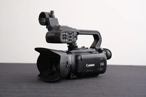 Canon XA25 Camcorder (SDI/HDMI) , w/Handle Unit HDU1, w/Wall Charger & Batteries - Picture 1 of 15
