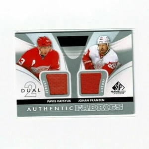 2012-13 SP GAME USED PAVEL DATSYUK JOHAN FRANZEN DUAL AUTHENTIC FABRICS - Bild 1 von 2