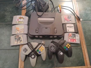 nintendo 64 konsole Mit 6 Spielen 2 Offizielle Paddles - Bild 1 von 19