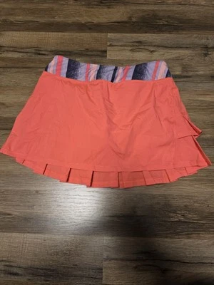 Falda deportiva para niña (falda con pantalones cortos) Ivivva de Lululemon talla 14 naranja Foto 1 de 4