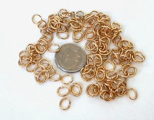 ONE HUNDRED - 7X6mm OVAL GOLD PLATED JUMP RINGS CF79 - Picture 1 of 1