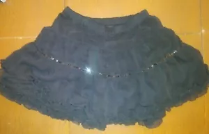 JUSTICE ADORABLE! GRÖSSE 10 AUSGEFALLENER SCHWARZER ROCK MIT RÜSCHEN IM LAGENLOOK POLY PAILLETTEN GEBRAUCHT - Bild 1 von 1
