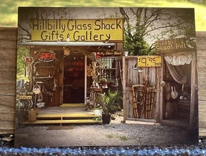 ✅Hillbilly Glass Shack Gifts & Gallery Postcard, Outhouse, Oak Grove, Arkansas - Picture 1 of 9