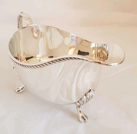 Antique sterling silver sauce / gravy boat .Sheffield 1976 .By Henry Hutton Co Cover