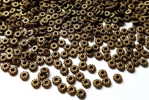 🎀 SALE 🎀 100 Antique Bronze Twisted Rondelle 4mm Spacer Beads For Jewellery - Picture 1 of 2