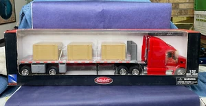 New Ray Longhauler Peterbilt 387 Flatbed Semi hauling Crates 1:32 NIB - Picture 1 of 11