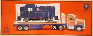LIONEL O Scale TMT-18416 LT-702 FLATBED TOY TRUCK WITH LOCOMOTIVE NON POWERED - Picture 1 of 4