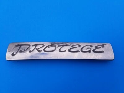 1992 1993 1994 1995 MAZDA PROTEGE REAR GATE EMBLEM LOGO BADGE SYMBOL OEM (1994) - Image 1 of 3