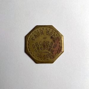 $1.00 Trade Token - Gregory, South Dakota, SD - Laur Bros. Grocery (#26) - Picture 1 of 2