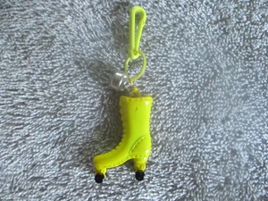 Vintage 1980's Plastic Clip On Bell Charm, Yellow & Black Roller Skate - Picture 1 of 3